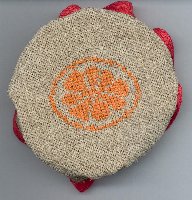 Dessus de pot de confiture orange